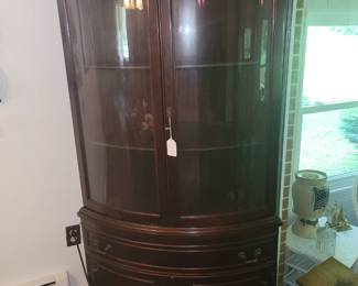 Bow front corner cabinet