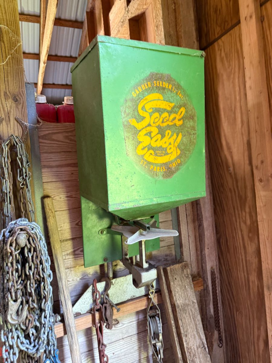 Antique seeder plus chains and functional equipment.