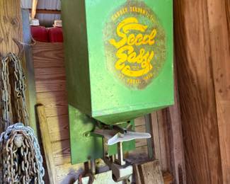 Antique seeder plus chains and functional equipment.