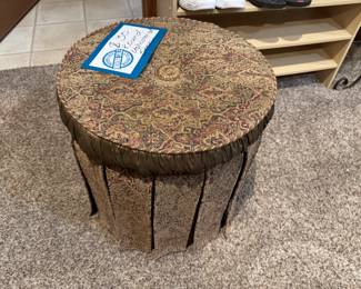 Round stool, upholstered in a rich tapestry.