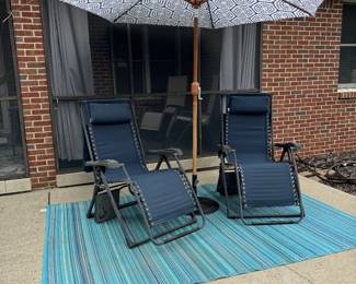 Patio umbrella with base, anti gravity chairs with built in drink holder and sun shades (Sam’s Club) and outdoor rug