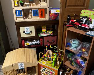 Here we have an amazing selection of toys, an interactive wooden doll house, a ranch that opens up for hours of play, and lots of other wonderful toys