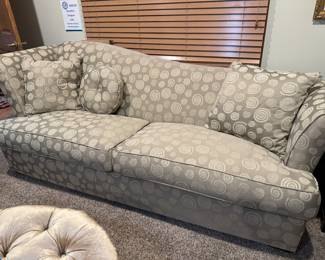 Large designer sofa with 3 coordinated pillows. Like new condition. 