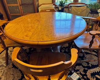 This Ethan Allen Mid-Century Modern table in Maple is  breathtaking. The table is 44” round with 2 leaves each 15”. The table can be set with one or both leaves. 