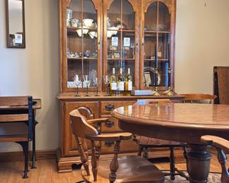 This Georgia’s med century modern table is an Ethan Allen. It included the 44” table with a breathtaking finish, 2 leaves each 15” to extend to a 74” oval, and 8 chairs. There is also a matching china cabinet and base lighted.  The entire set is in maple.