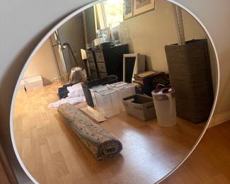 White framed circular mirror