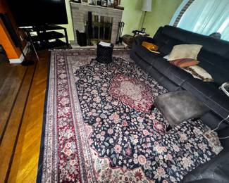 Gorgeous rugs and comfy couch