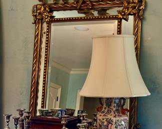 Large French mirror with hand carved birds in flight detail and stepped mirrored panels