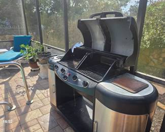 Large grill with a well for grease or water for cooking fries or seafood on the right hand side