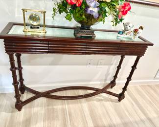 Striking entry table with antiqued mirror top