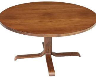 A striking Scandinavian mid-century modern coffee table, attributed to the manner of Niels Møller, circa 1960s. Featuring a broad, beautifully grained circular top (43.25" diameter) and distinctive bentwood tripod-style base, this piece showcases the organic elegance and functional artistry synonymous with Danish modern design. At 21.25" tall, it’s ideal for a lounge or sitting area—warm, minimal, and effortlessly chic.