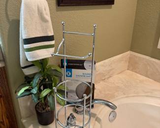 toilet paper holder, towel, faux plant