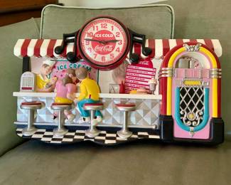 Vintage style Coca-Cola wall clock with an ice cream parlor theme