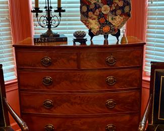 A late 1860s Georgian flame mahogany chest with stamped brass hardware in excellent condition. Some loss to veneer on edges commensurate with age.