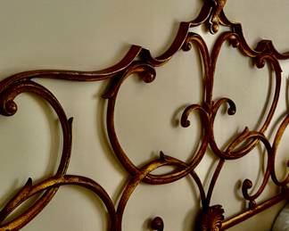 Antique Italian heavy scrolled wall mounted iron headboard in a king size