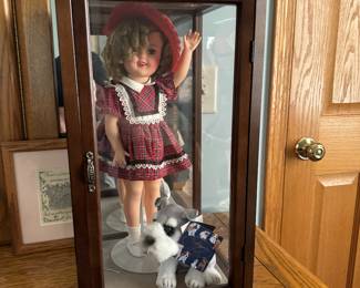 Antique Shirley Temple doll. The original box and some extra clothes go with it. The box is not perfect.