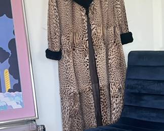 Vintage Baby Leopard JacketThis garment features baby leopard fur, complemented by a black sheared beaver collar and cuffs.
Size 6. * 2 weak spots on the hem of this coat. … seller would like $6000 obo