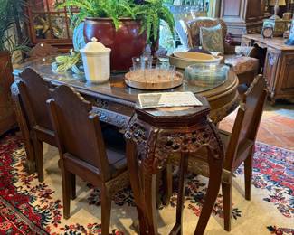 Carved oriental table and chairs