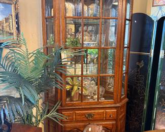 Tell City Lighted Corner Curio Cabinet. $324.95 This beautiful cabinet has one drawer that pulls out and two double doors below which has a shelf for storage. Measures approximately 43"W x 82 1/4" T x 16"D C2541