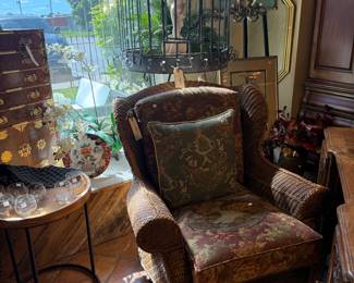 Brown wicker floral chair. $279.95 Measures approximately 54 1/2"W x 30"T x 34 1/4"D C2683