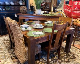 OK, Mission Style Rustic Table and 4 Chairs. $1,495.95
Measures approximately 54" x 54". C001 Two Wicker Chairs sold separately and priced individually at $189 each.