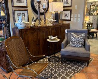 Mission Style Rustic Sideboard/Buffet. $1,894.95
This beauty has 4 doors below and offer tons of storage and a shelf in the middle. Measures approximately 17 1/2"D x 82"W x 41 1/4"T. C001 Uholstered Tweed & Brown Leather Arm Chair $489.95 C2688
Vintage MCM Rocker $389 C2636