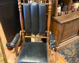 Antique wood & leather glider rocker. $249.95 Measures approximately 45"T x 22 1/2"W x 20"D C2196