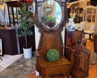 Antique Ornate Hall Tree. $750 Antique Hall Tree with bench and mirror. Bench top lifts to reveal storage. Absolutely beautiful piece. Measures approximately 32 1/2" W x 83"T x 16 3/4 D. C2701