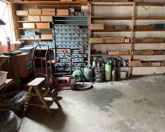 Garage full of items, lots of old wooden boxes