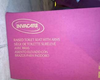 Invacare raised toilet seat with arms 