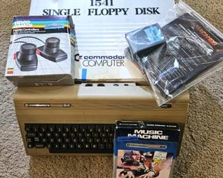 Commodore 64 computer with 1541 floppy disk drive.