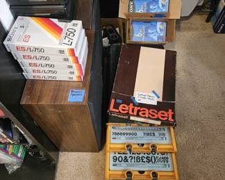Letraset drawers and transfer sheets. Panasonic speakers. Sealed VHS and BetaMax cassette tapes.
