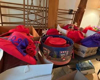 large selection of red hats, beautifully custom-made