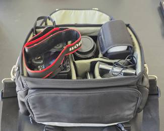 Canon EOS 50D digital camera with additional lenses and accessories