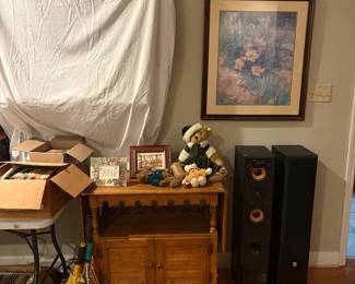 wine cart, speakers, artwork, tennis rackets, DVD