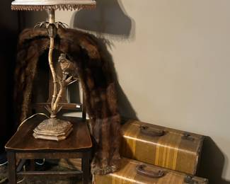 Pair of vintage suitcases and fur