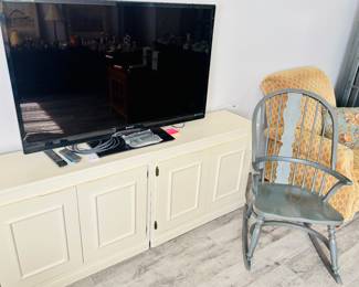 I would probably turn the chair around to watch the tv. But that's just me.