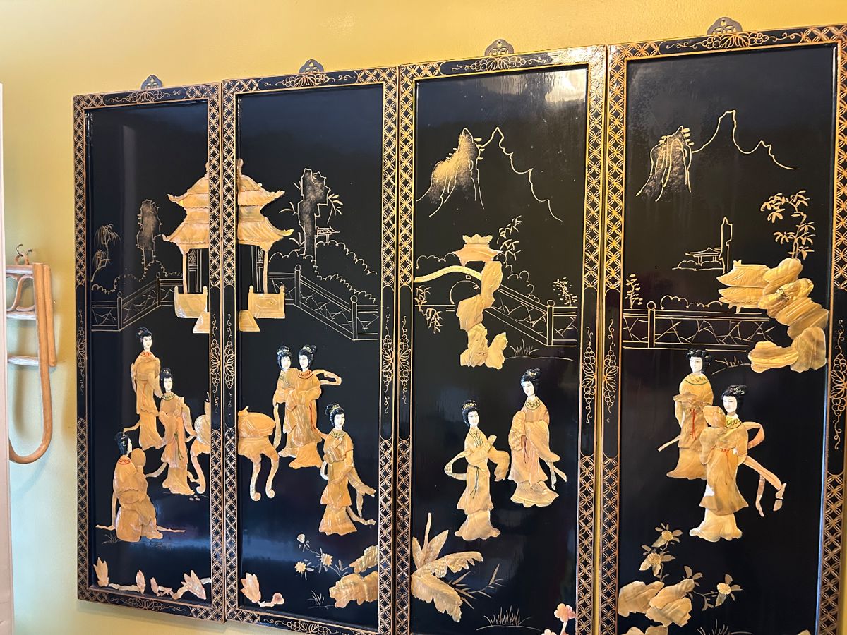 Four Chinese black lacquer wall panels