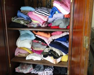 The inside of armoire (clothes not for sale)