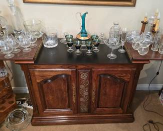 Vintage rolling buffet cabinet with flip-up expanding top.