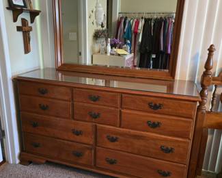 10 drawer low dresser with mirror. Glass top - perfect condition. Available for pre-sale