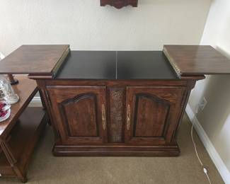 Vintage rolling buffet cabinet with flip-up expanding top