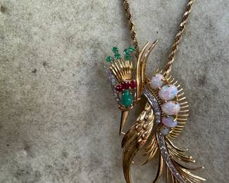 Extraordinary craftsmanship Crane 18kt gold brooch with Cabochon opal graduating size (5), 1 cabochon emerald and 5 natural emeralds with diamonds. weight 11.91 grams. Provenance from the Levin family - $1400 (chain not included)