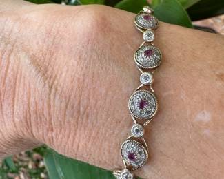 Bracelet 10kt gold - pink stones 7.5" long. 8.94 oz. $300