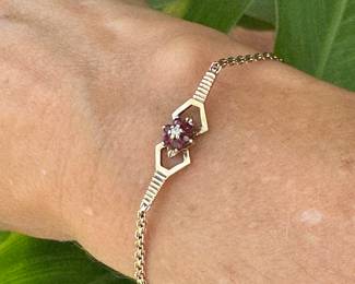 Bracelet 14kt yellow gold bracelet with garnet, size 6 3/4", 3.03 grams, $150.