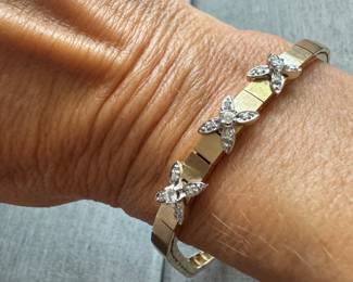 14kt gold Art deco style bracelet with diam in 3 flowers form. $1100