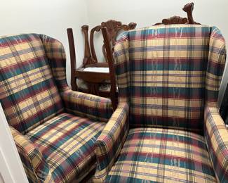 26 $120 each Pair of plaid wing back armchairs