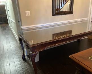 #42 - $700- Large mahogany table ball & claw feet 94Wx44Dx33H - glass top
