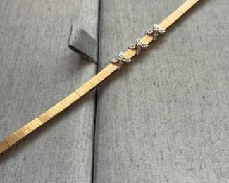 14kt gold Art deco style bracelet with diam in 3 flowers form. $1100