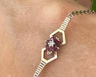 Bracelet 14kt yellow gold bracelet with garnet, size 6 3/4", 3.03 grams, $150.